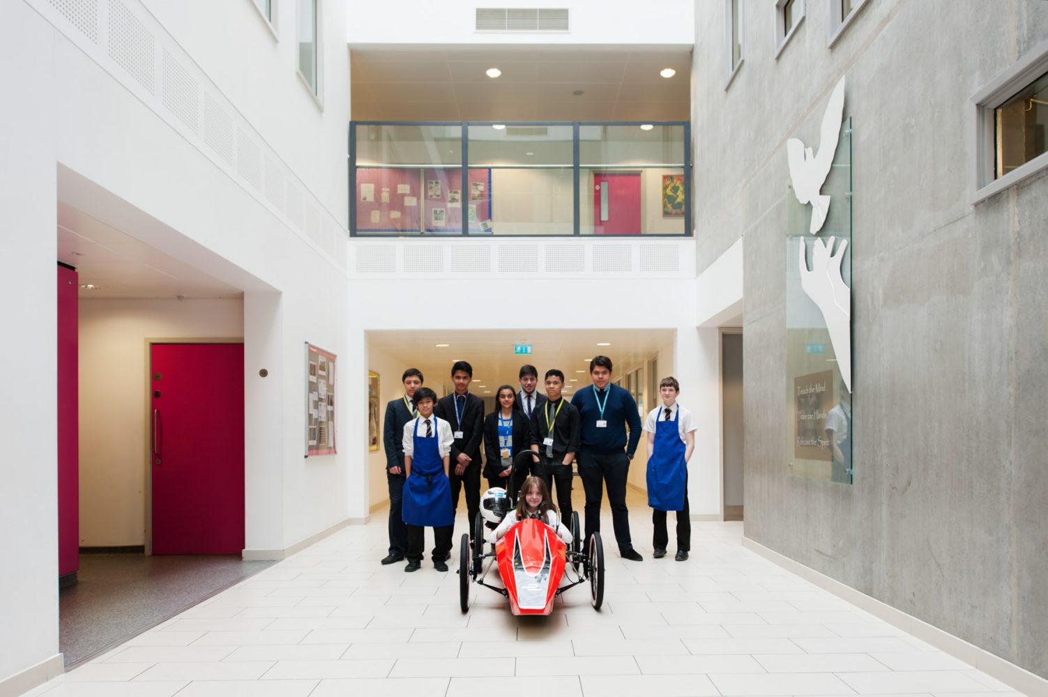 Academy school website photography of pupils with electric racing car