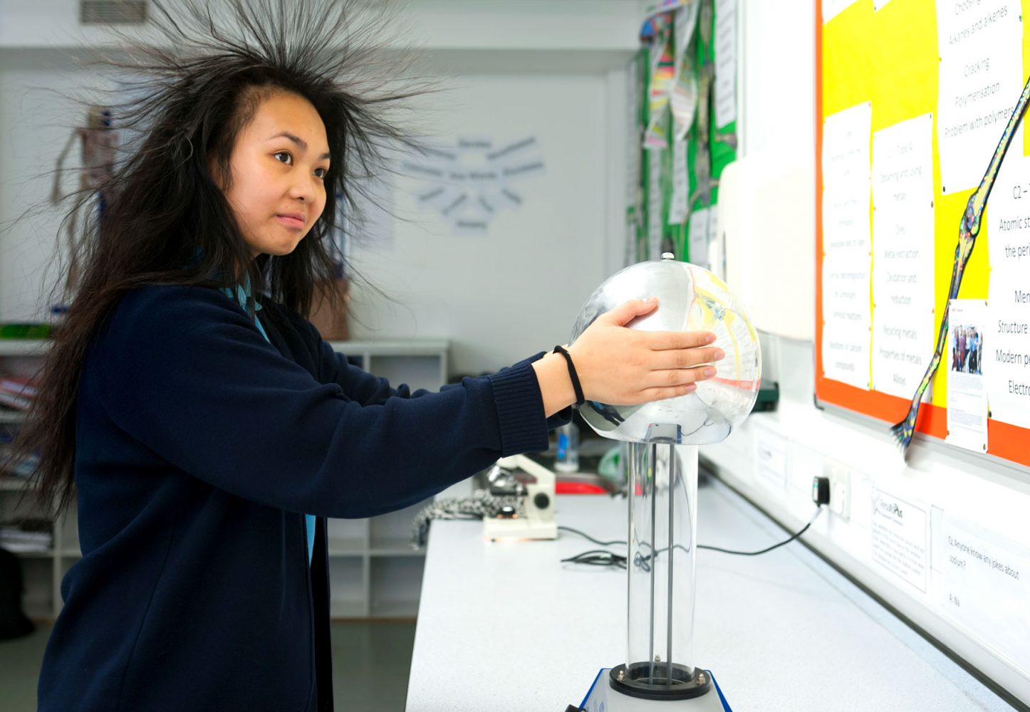 Secondary school pupil using a vandagraph generator